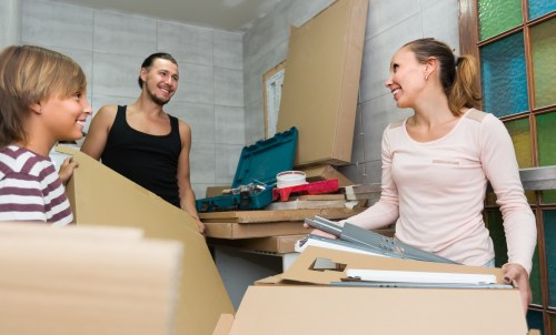 Removal team preparing safety checks before loading a van