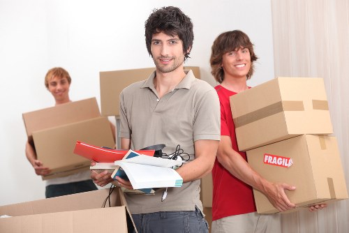 Office furniture and boxed equipment prepared for a Kennington commercial move