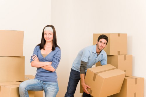Commercial relocation setup with labelled boxes and office furniture in Kennington