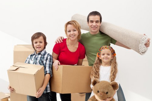 Removal van and movers handling furniture for a Kennington property move