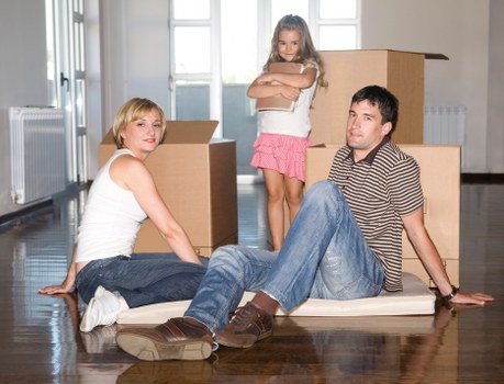 Removal workers reviewing safety steps during a job